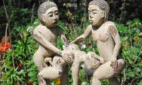 A statue depicting orgy threesome scene with two men and one woman