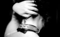Submissive wearing a BDSM collar in a collaring ceremony