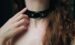 Leather o-ring BDSM collar on submissive woman